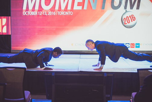 Pinball Clemons (left) and Brian Leon do 50 pushups at the Choice Fall Conference.